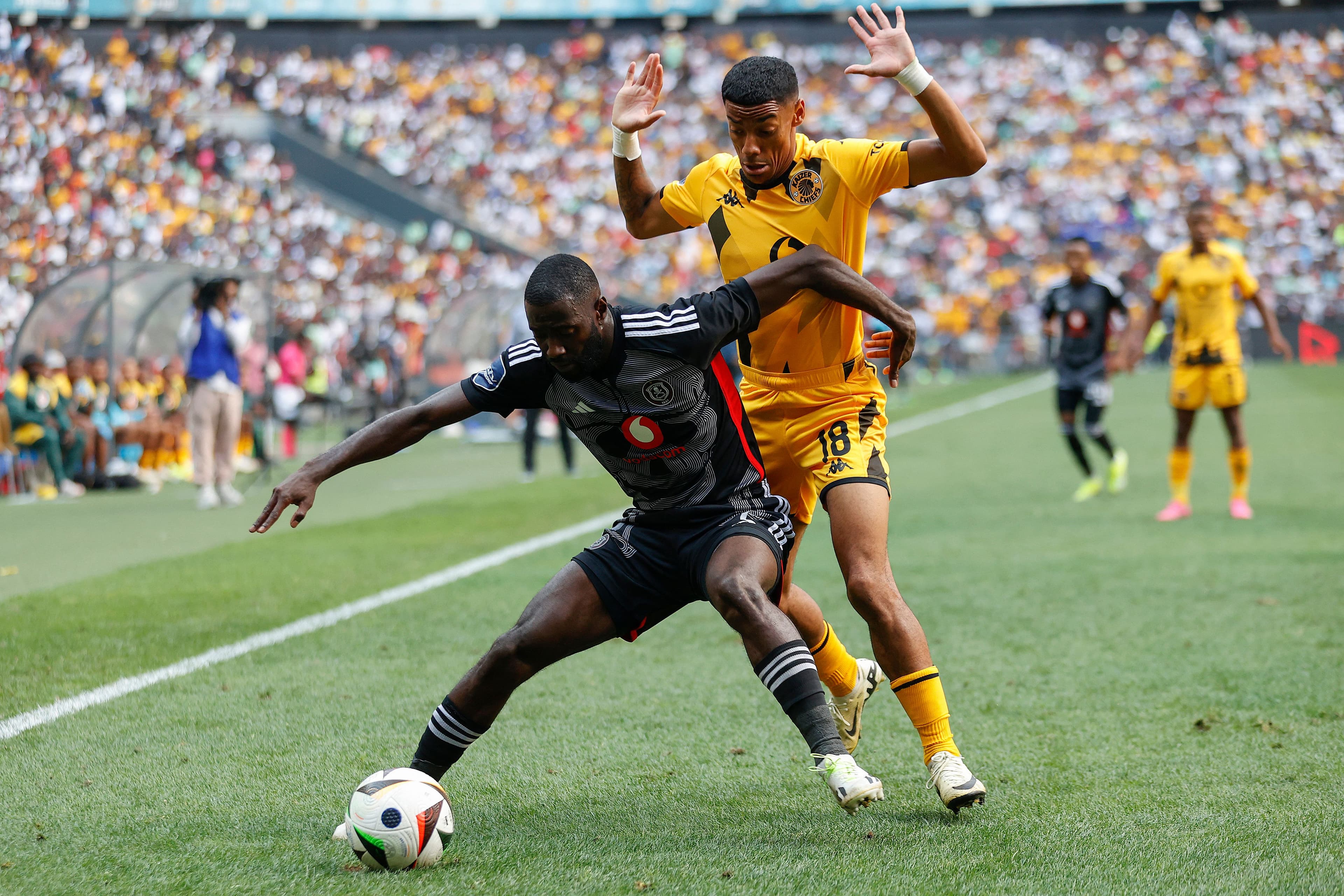 Deon Hotto fights for the ball with Dillan Solomons