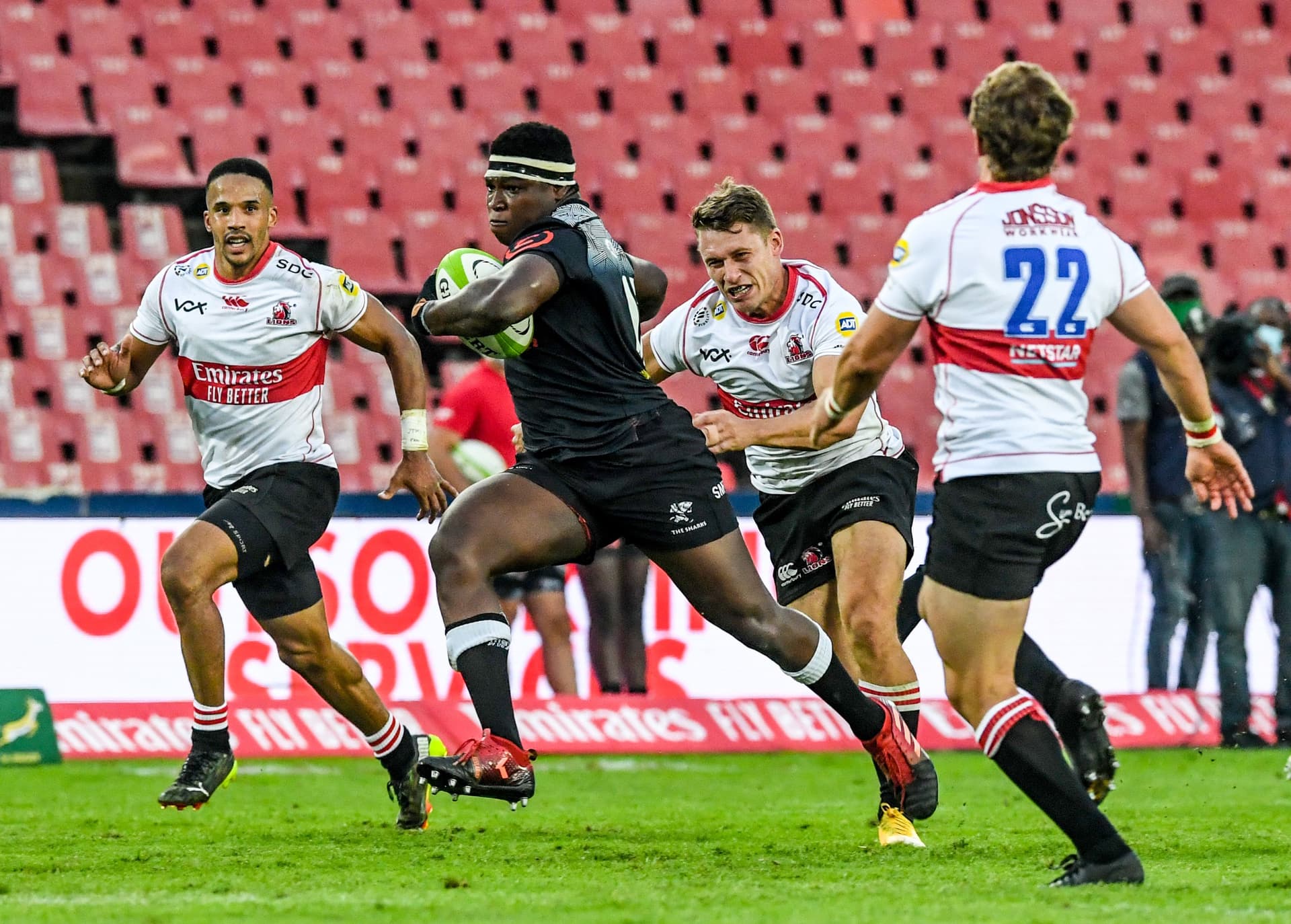 Ntuthuko Mchunu of the Sharks on his way to score a try after which he celebrated with teammates
