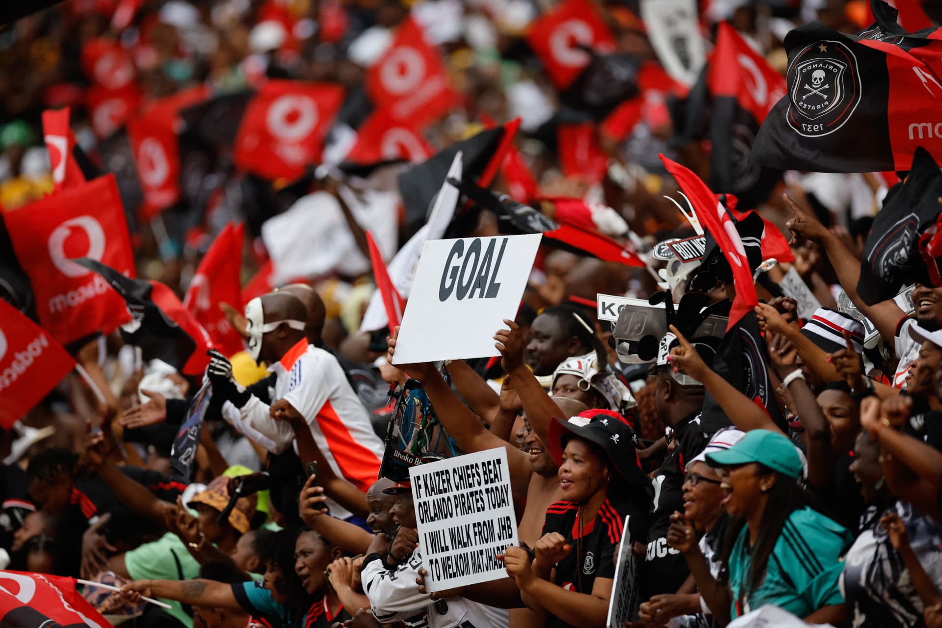 Orlando Pirates fans celebrate their team's win during the Premier Soccer League (PSL)