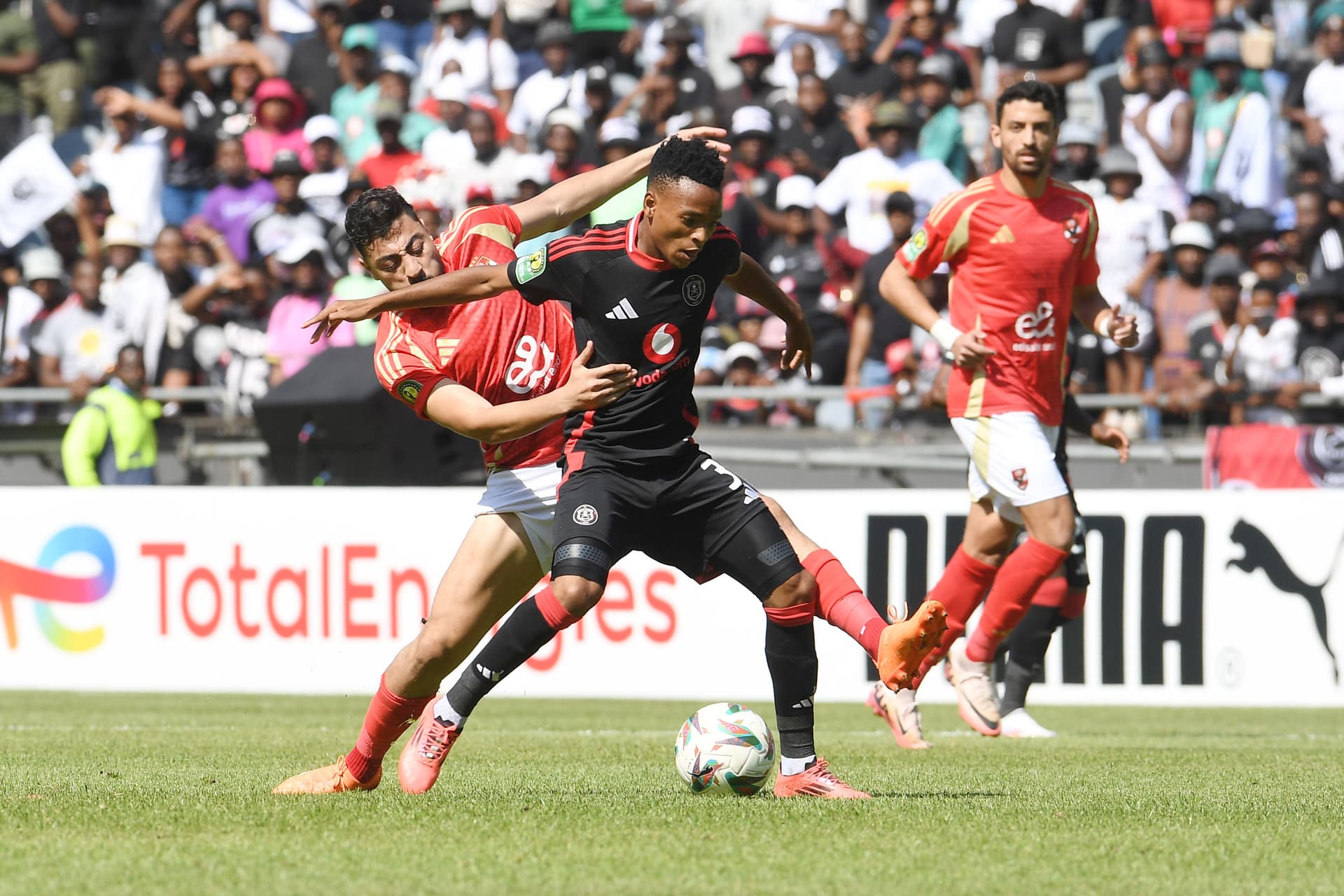 Relebohile Mofokeng of Orlando Pirates and Akram Elhagrasi