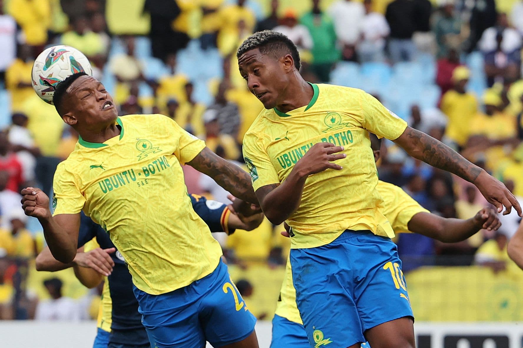 Sundowns' South African defender #20 Grant Kekana heads the ball